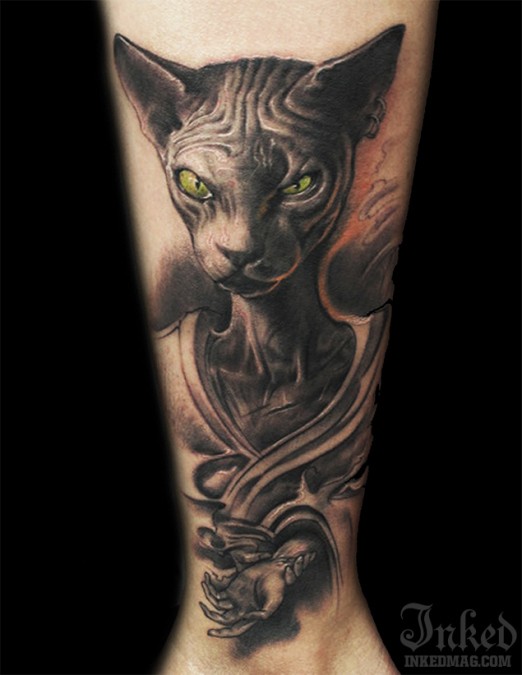 sphinx_cat_with_green_eyes_tattoo_by_LittleDragon.jpg
